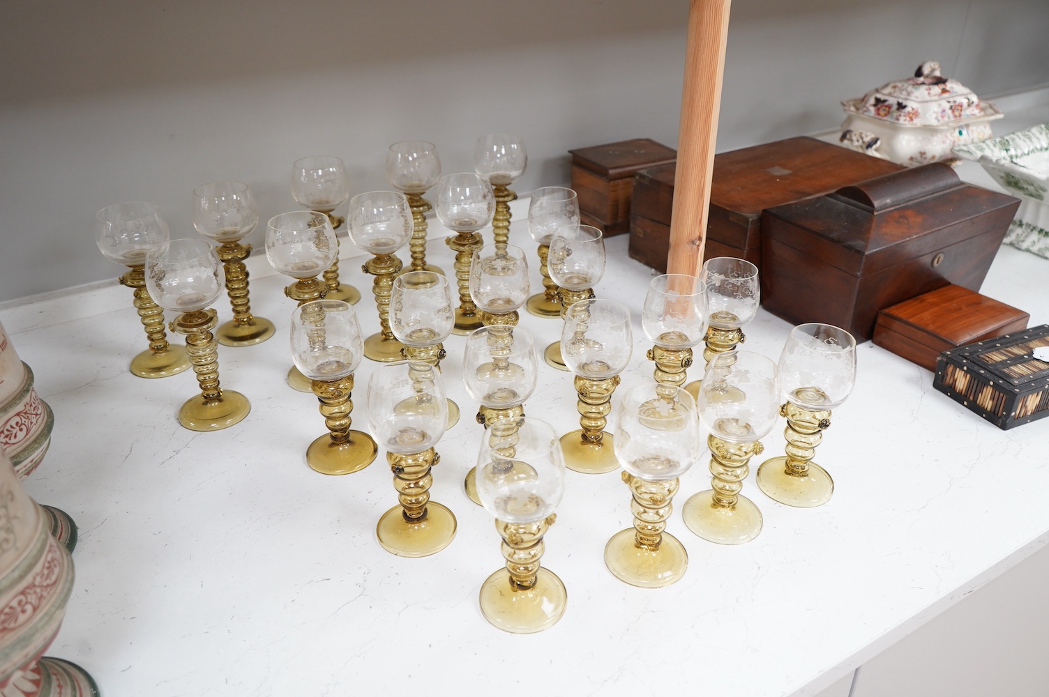 A collection of twenty three Dutch amber stemmed roemers, with etched bowls, largest each 19cm high. Condition - good